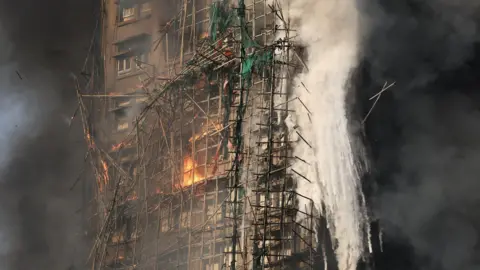 Tragedy Strikes in Hong Kong: Firefighters Search for Missing After High-Rise Blaze