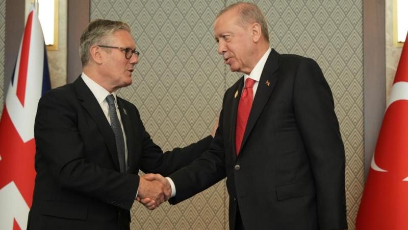 Turkish President Gifts UK Prime Minister a Revolver with Live Rounds at NATO Summit